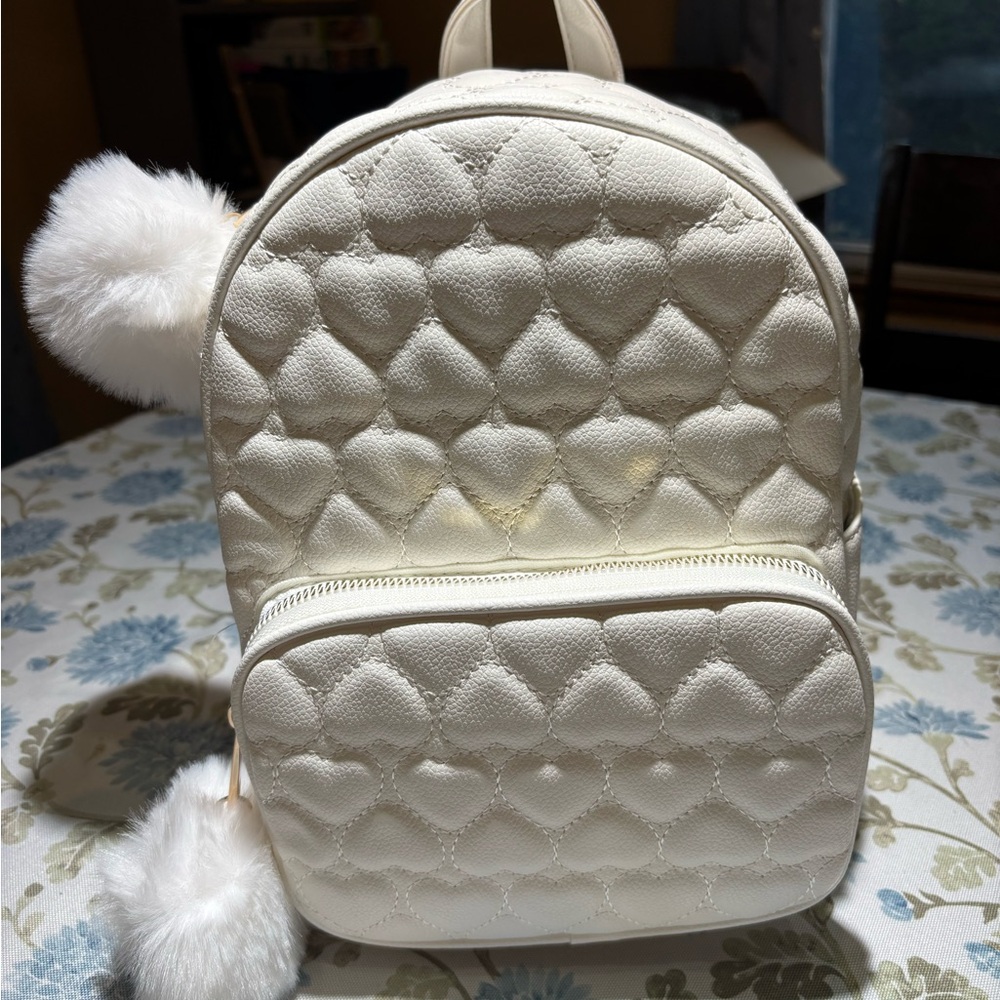 New White Quilted Backpack with Pom Poms
